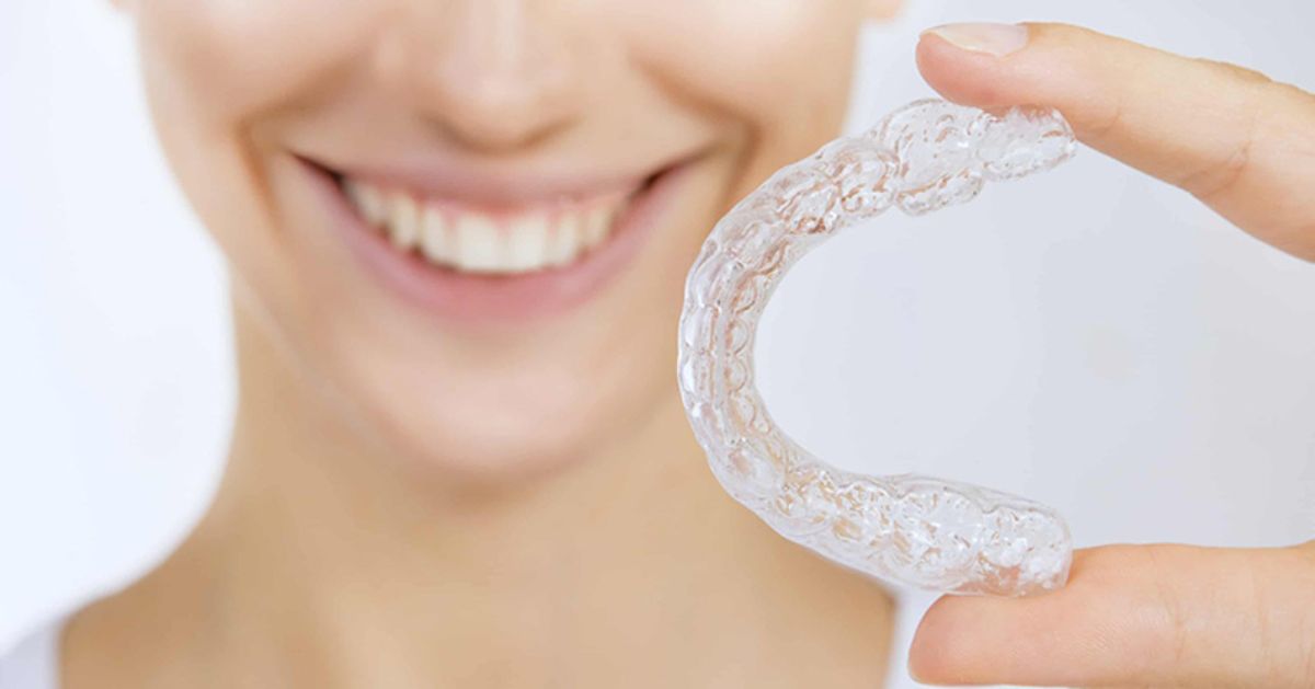 When it comes to straightening your smile, there are many different braces options. In the not-so-distant past, your options were pretty limited to big, cumbersome metal braces, but we’re proud to say a lot has changed over the years. While metal braces are still the most reliable and efficient option, they have become a worthy contender even when compared to the more modern options like ceramic braces and clear aligners like Invisalign. Choosing between the many types of braces is just as important of an investment decision as deciding where to go for a family vacation. Okay, maybe vacation is usually more fun than braces, but your best smile investment is worth the results and will last a lifetime. With the many advanced options available, you can likely plan your new smile and your next vacation without sacrificing your budget or lifestyle. Dr. Ryan Wiesemann and his skilled team at Wiesemann Orthodontics are committed to providing high-quality orthodontic treatment options that fit your needs, lifestyle, and budget for patients all around Bowling Green and Russellville, Kentucky, and Portland and White House, Tennessee. Dr. Wiesemann believes your smile should be done right, and he works hard to ensure each person loves their smile. Let’s go over the different types of braces we specialize in here at Wiesemann Orthodontics. That will ensure you’re prepared for your first visit on your journey to your new smile! Braces Basics In any discussion about orthodontic treatment, you should consider the difference between your fixed and removable options. At one time, all braces were fixed braces. They adhered to your teeth, and that was the end of the structural design, much less the options for appearances or aesthetics. Now, not only have your fixed braces options expanded, but you also have removable braces options that can give you an efficient treatment while meeting your style and easing your hygiene routine during the process. It’s like you can have your cake and eat it, too; just remember to floss and brush well afterward. Fixed Orthodontic Appliances Fixed braces are orthodontic appliances that are applied directly to your teeth and can only be removed by your orthodontist at the end of your treatment. There is no denying the power that comes from a direct bond in manipulating the movements of your teeth, gums, and even jaw. When it is proven the most efficient way to straighten your smile, the only thing that can be done to improve the process is to make it more comfortable and visually pleasing, or at least less visibly noticeable. That’s just what has happened with traditional metal braces. They aren’t so conventional anymore. The old bulky brackets have been replaced with smaller, lighter, and sleeker brackets made of high-quality metal or ceramic materials. The archwire is even thinner while being stronger. For our Wiesemann Orthodontics patients, we offer a huge selection of colorful elastic bands that we utilize for a fun spin on our ligatures. Some versions of metal braces, called self-ligating braces, eliminate the ligatures that secure the archwire to the brackets by using a bracket that includes a clip mechanism. This clip allows the bracket to slide along the archwire comfortably while maintaining adequate pressure to keep your treatment plan on track. Another modern fixed orthodontic appliance that has come about more recently is an option called lingual braces. Lingual braces still utilize the direct bond of brackets to your teeth, but instead of placing the brackets on the front side of your teeth, this method places the brackets on the back side of your teeth. In order for this option to be efficient, a special archwire must be utilized. Many patients find that while this is an aesthetic option, it does take a bit to get used to the placement– and with the innovative option of Invisalign, is it worth it? Removable Orthodontic Appliances Removable braces are not bonded to your teeth and can be removed from your mouth. Removable orthodontic appliances like retainers and mouthguards are well-known maintenance devices that ensure your smile doesn’t shift or incur trauma after your teeth and bite have been aligned, but they are not actual straightening options. A less-known appliance called palatal expanders help create space in your mouth for the proper growth and alignment of your teeth, so while they seem to straighten your smile, they are usually not used alone for that goal. When creating that smile alignment that changes your life with removable orthodontic braces, our Wiesemann Orthodontics team has plenty of experience utilizing Invisalign clear aligners. Clear aligners work much like post-metal braces retainers of the past, except as a treatment option, they are stronger and must be worn for 22 hours each day to ensure your best results. This nearly invisible option will gently move your teeth into place based on the precise movements of your treatment plan without compromising your appearance. Because you can remove them, you are not restricted in what you can eat and can even take them off to get a thorough floss and brush as you would outside of orthodontic treatment. Wiesemann Orthodontics is the wise choice for your braces options! By pairing state-of-the-art technology with our thorough understanding of the movement and growth of the teeth and jaws, our experienced Wiesemann Orthodontics team can treat many dental issues like gapped or crowded teeth, protruding or impacted teeth, and the many variations of bite concerns. While traditional metal braces are the most common option for the majority of the patients we treat, you have several great options that will lead to a great smile in the end! We are committed to giving patients amazing smiles through the latest orthodontic treatments. Dr. Wiesemann and his compassionate teams work hard to ensure you and your family feel right at home each time you step into our offices. You can expect quality care and excellent customer service because our team is dedicated to your unique needs. Schedule your FREE consultation today to determine which treatment would best suit your individual needs and smile goals.