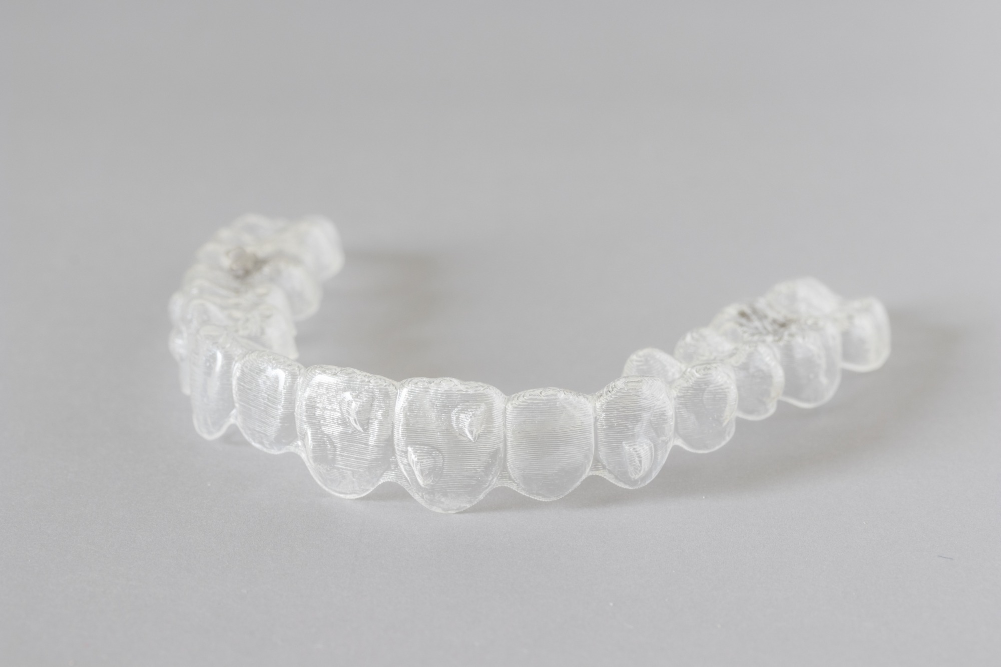 Clear orthodontic retainer worn after braces treatment at Wiesemann Orthodontics in Bowling Green KY