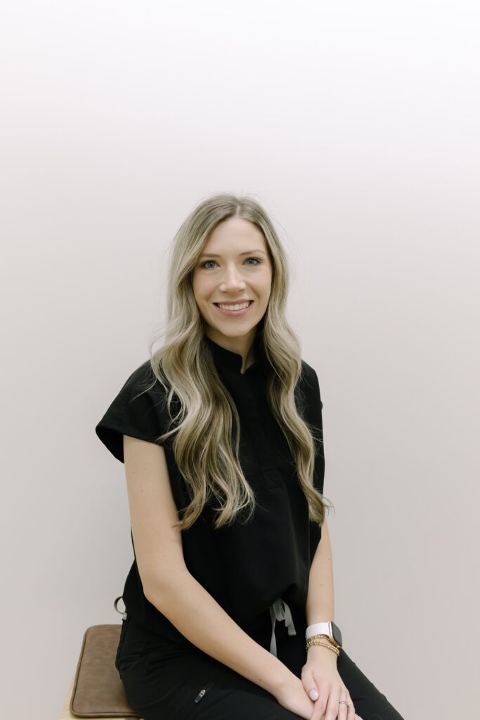 Cameron, treatment coordinator at Wiesemann Orthodontics, smiling in a black uniform, representing friendly orthodontic care in Bowling Green, KY.